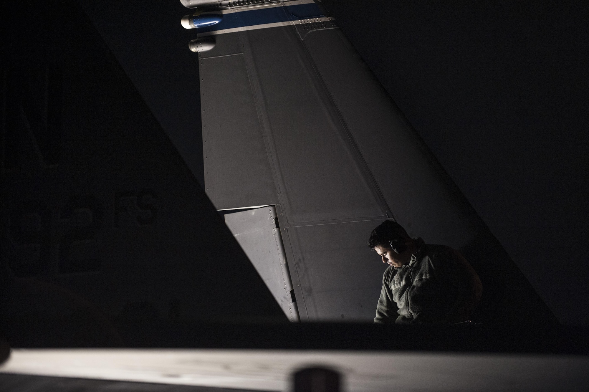 An aircraft maintainer from the 332nd Expeditionary Maintenance Squadron performs pre-flight checks on an F-15E Strike Eagle prior to an early-morning takeoff October 4, 2017, at an undisclosed location in Southwest Asia. During their time in the region, maintenance Airmen were responsible for generating hundreds of combat sorties per month.