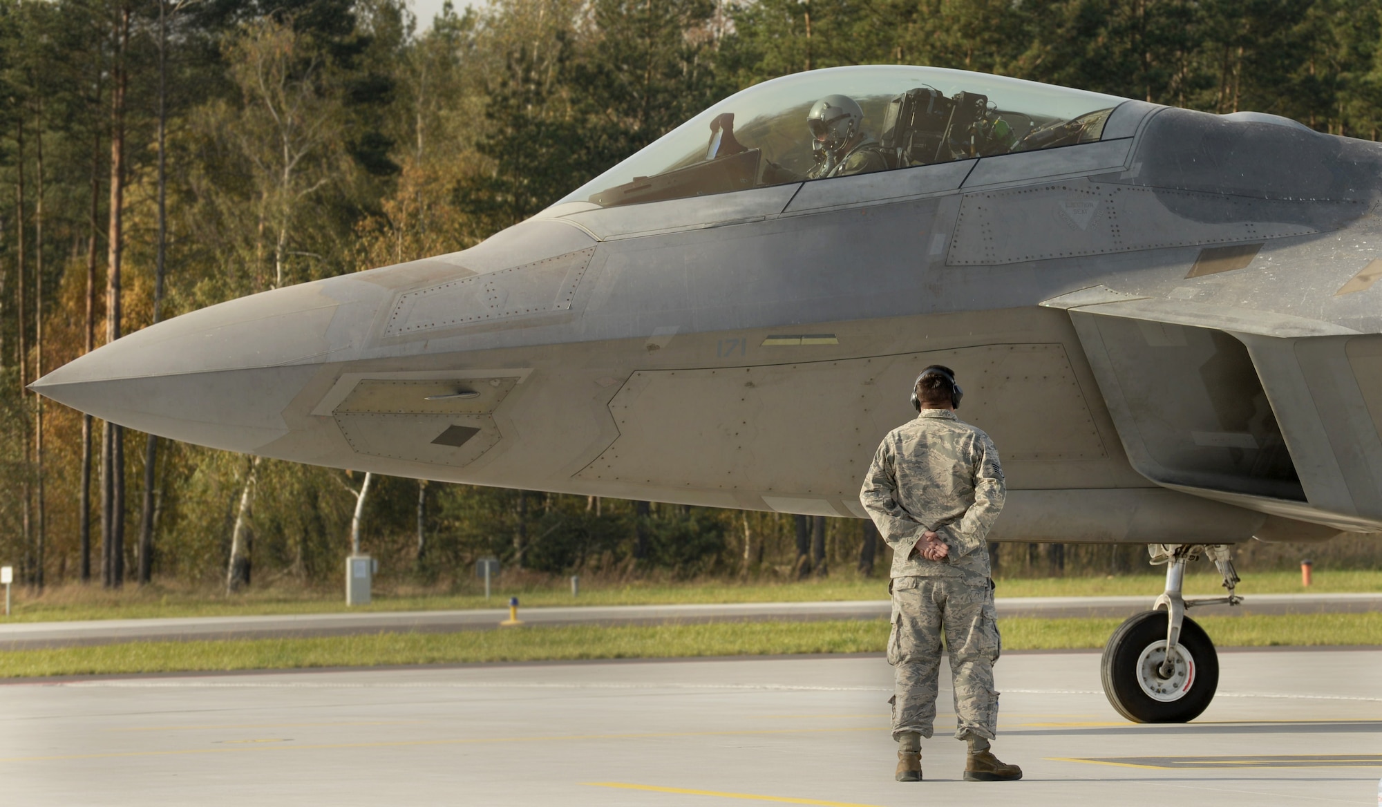 A U.S. Air Force F-22 Raptor pilot from the 1st Fighter Wing, Joint Base Langley-Eustis, Va., prepares for takeoff on the flightline Oct. 17, 2017, at Powidz Air Base, Poland. This forward deployment is an opportunity for the F-22s to maximize training opportunities, demonstrate the U.S. Air Force’s steadfast commitment to NATO allies and deter any actions that destabilize regional security. (U.S. Air Force photo by Senior Airman Tenley Long)