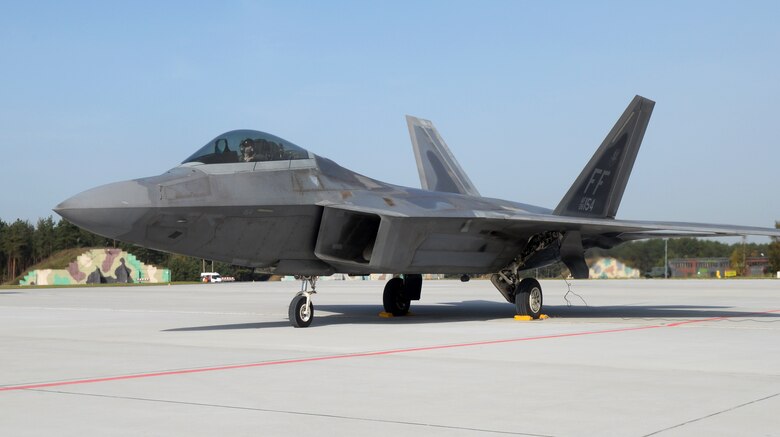A U.S. Air Force F-22 Raptor from the 1st Fighter Wing, Joint Base Langley-Eustis, Va., sits on the flightline Oct. 17, 2017, at Powidz Air Base, Poland. The Raptors forward deployed from RAF Lakenheath in support of the training and exercises with U.S. Air Force F-15 aircraft and NATO allies. (U.S. Air Force photo by Senior Airman Tenley Long)