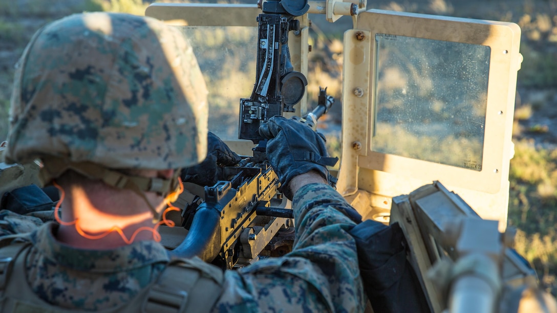 A Marine with 1st Law Enforcement Battalion, I Marine Information Group, loads the M240B machine gun during a live fire training exercise on Camp Pendleton, Calif., Oct. 24, 2017.The importance of this exercise was to prepare the Marines for their upcoming deployment with the 13th Marine Expeditionary Unit.