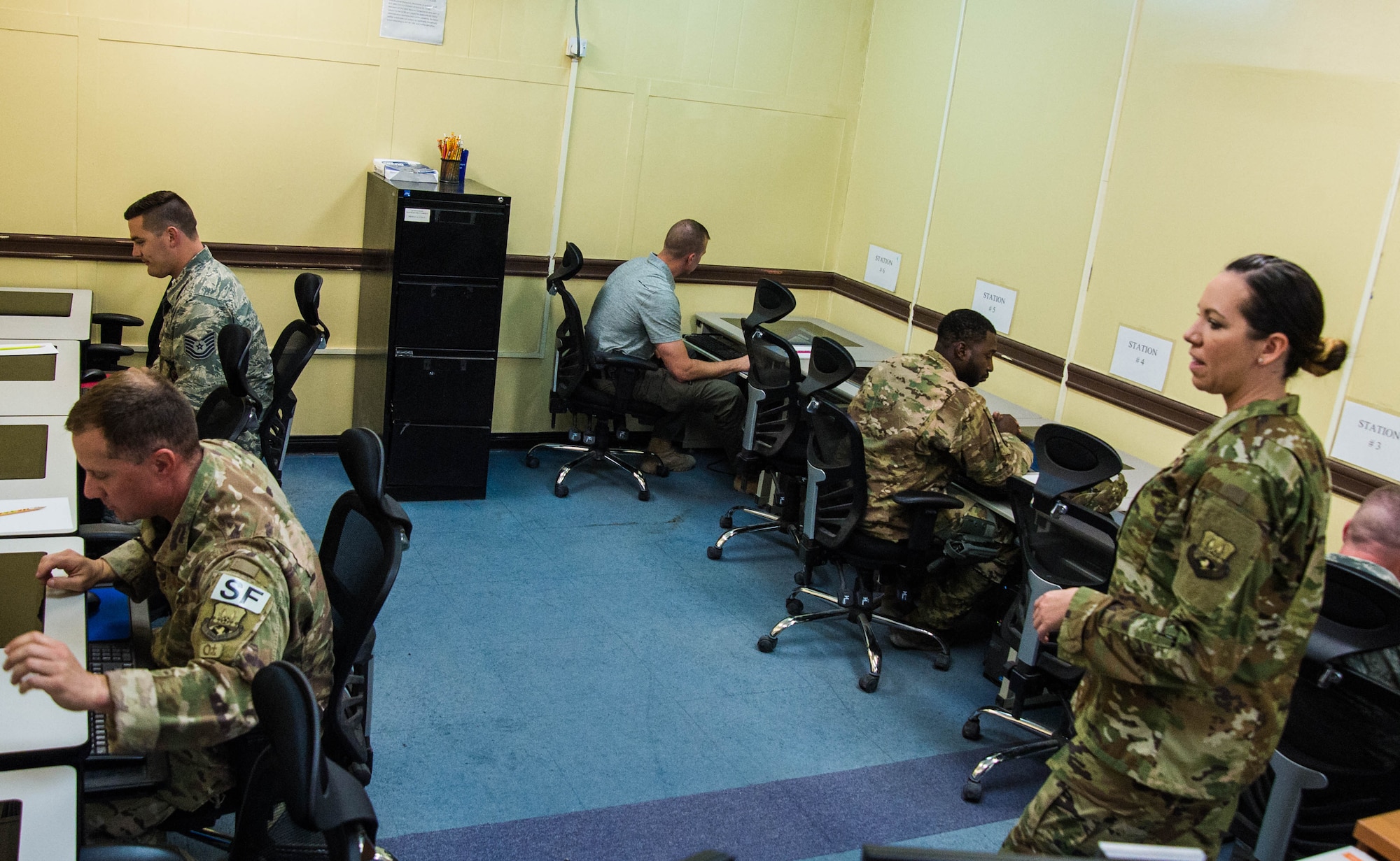Tech. Sgt. Andrea Grabner, 386th Expeditionary Force Support Squadron test control officer, instructs Airmen prior to testing in the installation Education Center at an undisclosed location in Southwest Asia, Oct. 23, 2017. Education centers provide important resources allowing Airmen to continue their education while deployed. (Air Force photo by Staff Sgt. William Banton)