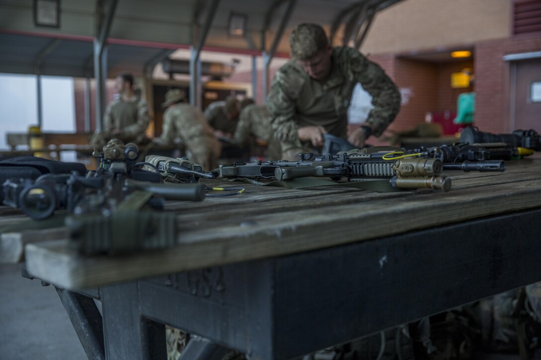 Royal Marines prepare their gear for a ground insertion operation during Bold Alligator 17 at Marine Corps Base Camp Lejeune, Oct. 20, 2017. Bold Alligator 17 is a training exercise focused on a regimental amphibious assault that allows the Navy and Marine Corps team to train with partner nations to refine and strengthen core amphibious competencies critical to maritime power projection.