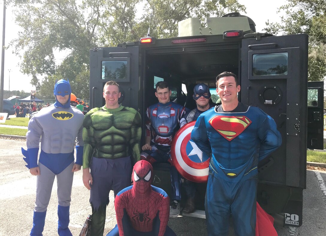 Marines and sailors from Alpha Co., Bravo Co., and Headquarters and Service Co., Marine Corps Security Force Battalion Kings Bay, dress up for the annual Trunk-or-Treat event held at Naval Submarine Base Kings Bay's fitness center and Sail Point Park, in Kings Bay, Ga., Oct. 21. NSB Kings Bay MWR personnel organized music, fun and games for kids and base personnel to enjoy throughout the afternoon. (Official Navy photo by Petty Officer 1st Class Tara Gonga/Released)