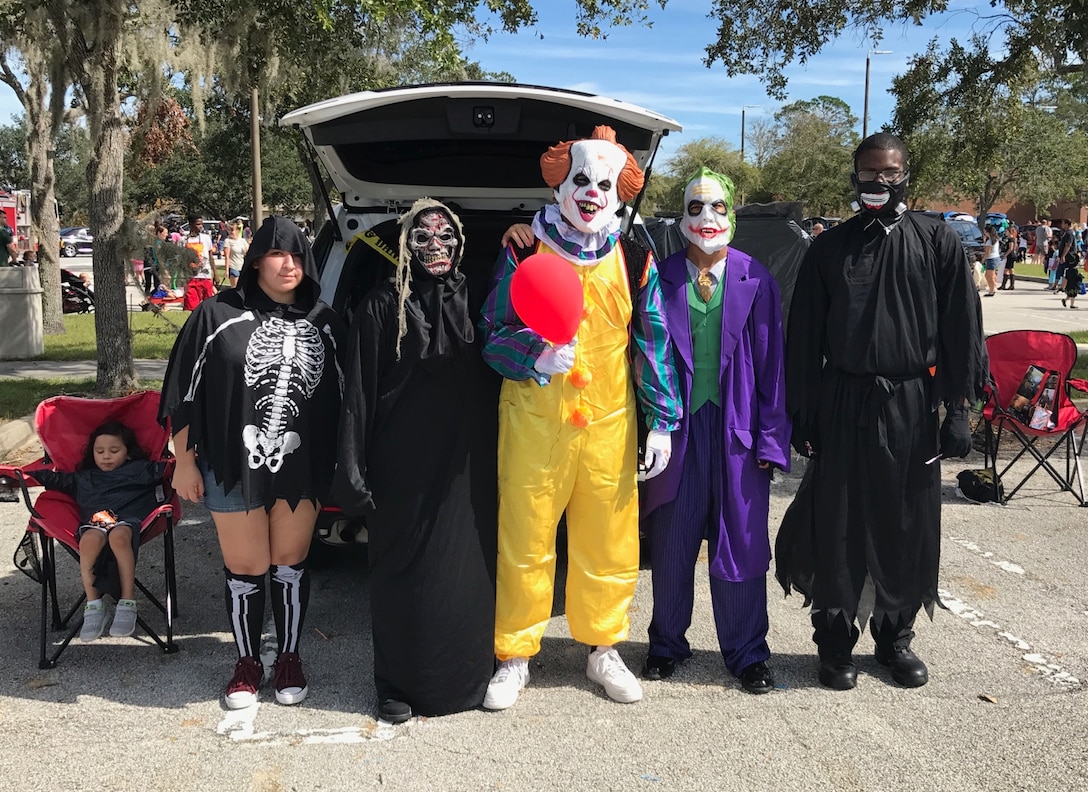 Sailors from 5th platoon, Bravo Co., Marine Corps Security Force Battalion Kings Bay, dress up for the annual Trunk-or-Treat event held at the base fitness center aboard Naval Submarine Base Kings Bay, Ga., Oct. 21. Service members from various units across the base participated in this event, volunteering to hand out candy and support the other events hosted during the holiday event. (Official Navy photo by Petty Officer 1st Class Tara Gonga/Released)