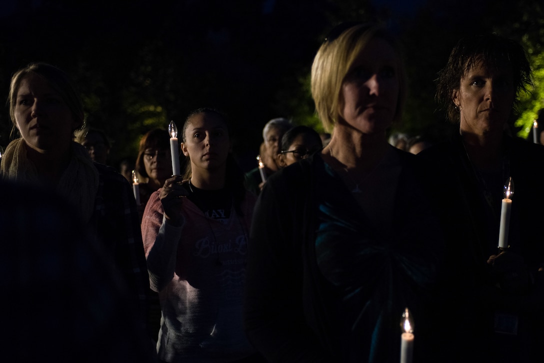 Women from the Oklahoma Air and Army National Guard hold candlelights during a remembrance ceremony for all the women servicemembers who have died in the line of duty, Oct. 21, 2017, at the Women in Military Service for America Memorial at Arlington Cemetary in Washington D.C. Nearly 40 Oklahoma Air and Army National Guard women gathered with hundreds of active-duty, retired and reserve servicewomen from all branches of the military to celebrate the 20th anniversary of the dedication of the Women in Military Service for America Memorial to honor the women who came before them and celebrate the opportunities that are still to come. (U.S. Air National Guard photo by Staff Sgt. Kasey Phipps)