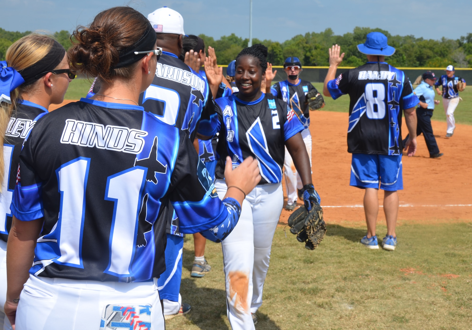 Tech. Sgt. Shameka White and her All-Air Force women's softball teammates celebrate a victory over the Army during the Armed Forces Championships in September on Joint Base San Antonio-Fort Sam Houston. (U.S. Air Force photo by Steve Warns)