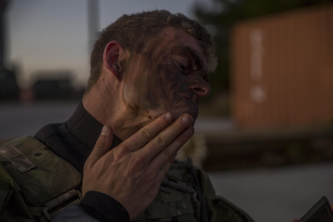 A Royal Marine applies camouflage paint to his face for a ground insertion operation during Bold Alligator 17 at Marine Corps Base Camp Lejeune, Oct. 20, 2017. Bold Alligator 17 is a training exercise focused on a regimental amphibious assault that allows the Navy and Marine Corps team to train with partner nations to refine and strengthen core amphibious competencies critical to maritime power projection.