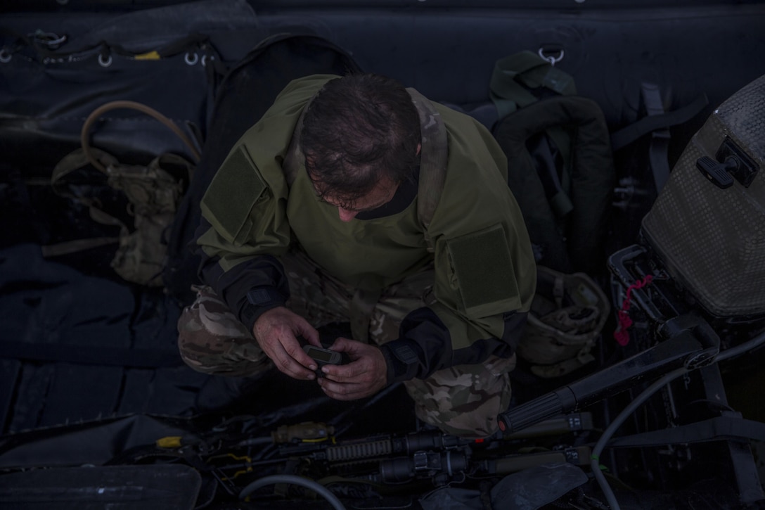 A Royal Marine checks his GPS before participating in a ground insertion operation during Bold Alligator 17 at Marine Corps Base Camp Lejeune, Oct. 20, 2017. Bold Alligator 17 is a training exercise focused on a regimental amphibious assault that allows the Navy and Marine Corps team to train with partner nations to refine and strengthen core amphibious competencies critical to maritime power projection.