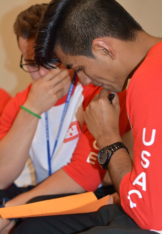 Christian Lopez-Garcia, front, and his friend, Tyler Miller, foreground, brainstorm over questions prior to the "Deal or No Deal" round during the Hispanic Engineer National Achievement Awards Conference College Bowl Oct. 20 in Pasadena, Calif. Both Miller and Lopez-Garcia were on the U.S. Army Corps of Engineers team during the event. Great Minds in STEM's annual HENAAC Conference is the organization's flagship event to celebrate Hispanic excellence in STEM. This year's event was Oct. 18 to 22 in Pasadena.