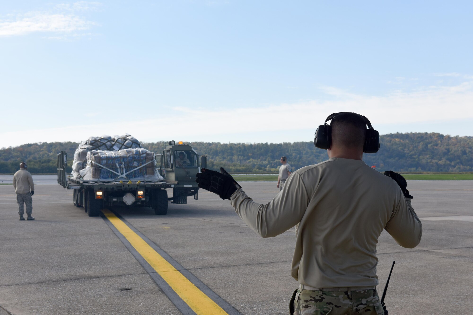 A cargo loader at the 193rd Special Operations Wing, Middletown, Pennsylvania, prepares to load cargo onto an LC-130H Hercules aircraft from Schenectady, New York, October 25, 2017. The aircraft with bring RED HORSE Airmen from Fort Indiantown Gap, Annville, Pennsylvania, to St. Croix, U. S. Virgin Islands, in support of Hurricane Maria's relief and rebuilding efforts. They will maintain the tents and various equipment used in the Disaster Relief Bed-down System for responders. (U.S. Air National Guard photo by Master Sgt. Matt Schwartz/Released)