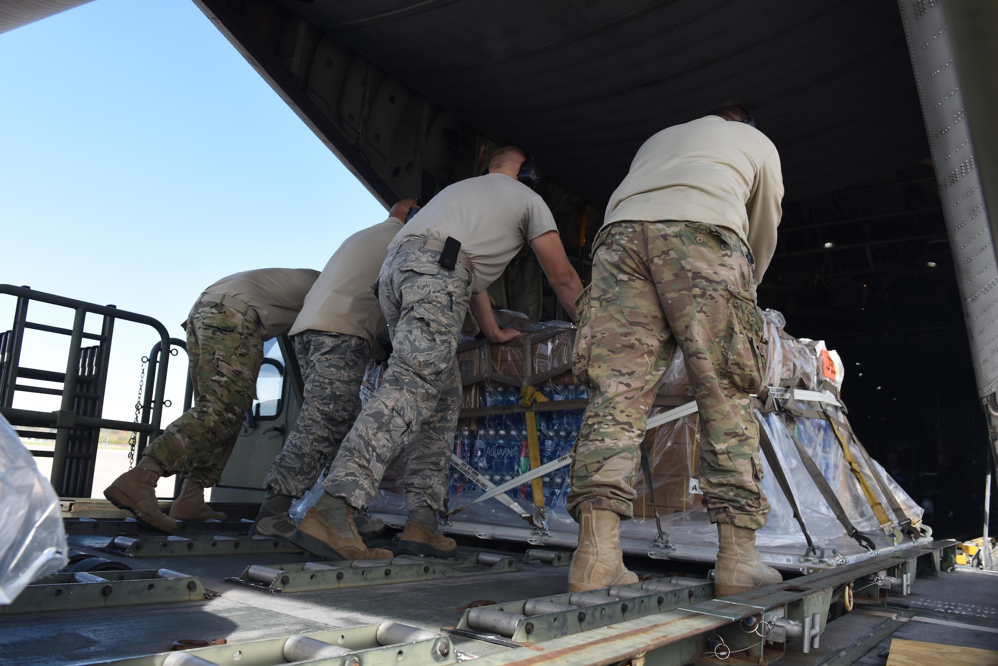 Airmen from the 193rd Special Operations Wing's Aerial Port, Middletown, Pennsylvania, load cargo on an  LC-130H Hercules, from the 109th Airlift Wing, Schenectady, New York, October 25, 2017. The Aircraft is being used to send 201st RED HORSE Squadron Airmen to St. Croix, U.S. Virgin Islands in support of Hurricane Maria's relief and rebuilding efforts. They will maintain the tents and various equipment used in the Disaster Relief Bed-down System for responder. (U.S. Air National Guard photo by Master Sgt. Matt Schwartz/Released)