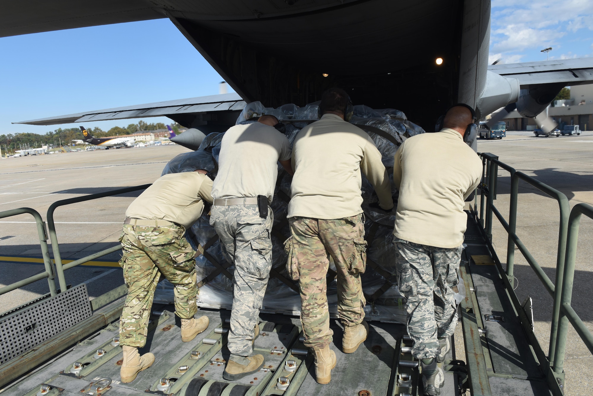 Airmen from the 193rd Special Operations Wing's Aerial Port, Middletown, Pennsylvania, load cargo on an  LC-130H Hercules, from the 109th Airlift Wing, Schenectady, New York, October 25, 2017. The Aircraft is being used to send 201st RED HORSE Squadron Airmen to St. Croix, U.S. Virgin Islands in support of Hurricane Maria's relief and rebuilding efforts. They will maintain the tents and various equipment used in the Disaster Relief Bed-down System for responder. (U.S. Air National Guard photo by Master Sgt. Matt Schwartz/Released)