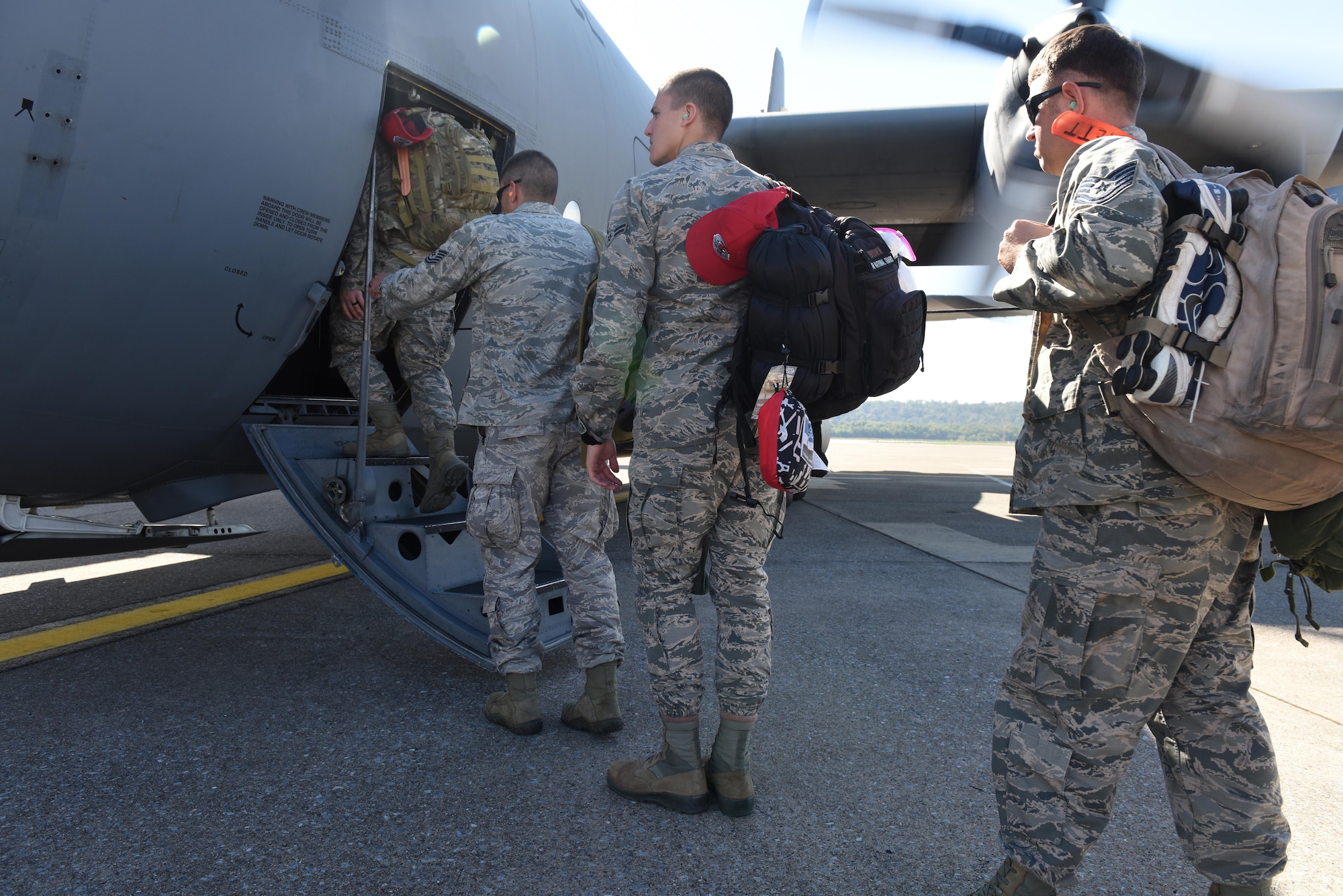 201st RED HORSE Squadron Airmen, from Ft. Indiantown Gap, Annville, Pennsylvania, board a 109th Airlift Wing, LC-130H Hercules aircraft, at Middletown, Pennsylvania, on their way to St. Croix, U.S. Virgin Islands, Oct. 25, 2017. They will maintain the tents and various equipment used in the Disaster Relief Bed-down System for responders, in support of Hurricane Maria's relief and rebuilding efforts.  (U.S. Air National Guard photo by Master Sgt. Matt Schwartz/Released)