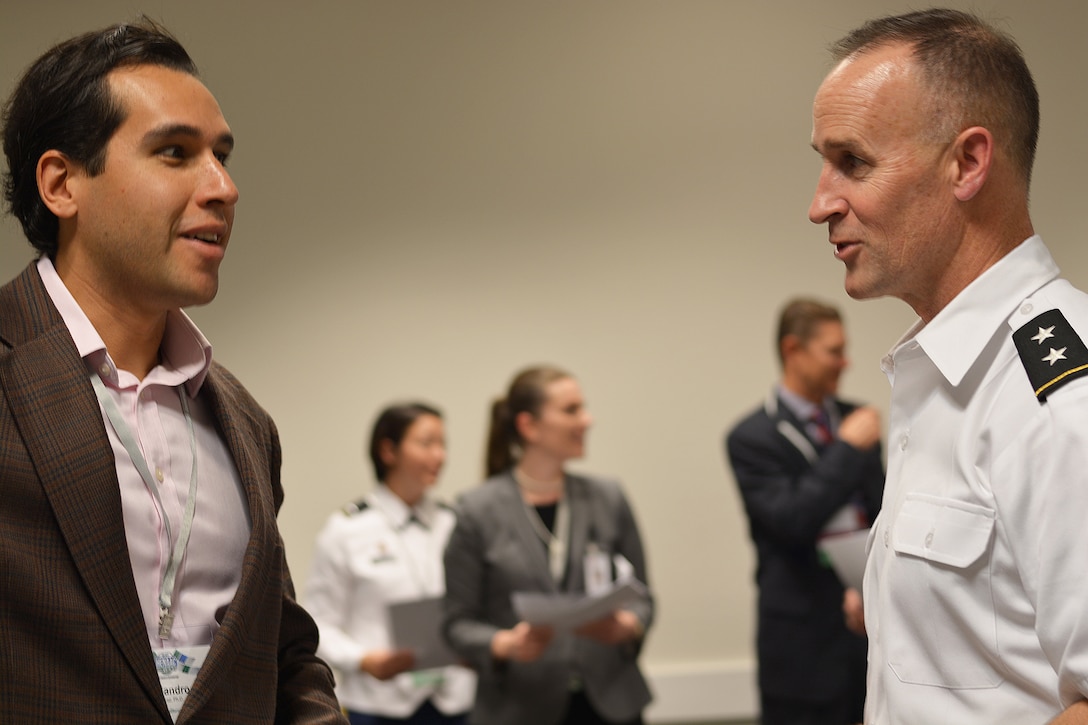 Alejandro Gutierrez, assistant teaching professor with the School of Engineering, University of California-Merced, left, discusses partnership opportunities with Maj. Gen. Michael Wehr, deputy commander of the U.S. Army Corps of Engineers, right, following an Oct. 19 seminar at the Great Minds in STEM's annual Hispanic Engineer National Achievement Awards Conference in Pasadena, Calif.