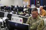 Army North personnel coordinate support and logisitics at the Joint Operations Center during Hurricane Maria disaster relief operations at Joint Base San Antonio-Fort Sam Houston Oct. 24. The JOC is always maintained by about 30 personnel - consisting of Army, Air Force, Navy, Marine Corps, Coast Guard, and civilian contractors - in 24/7 support of military and civilian entities during times of crisis.