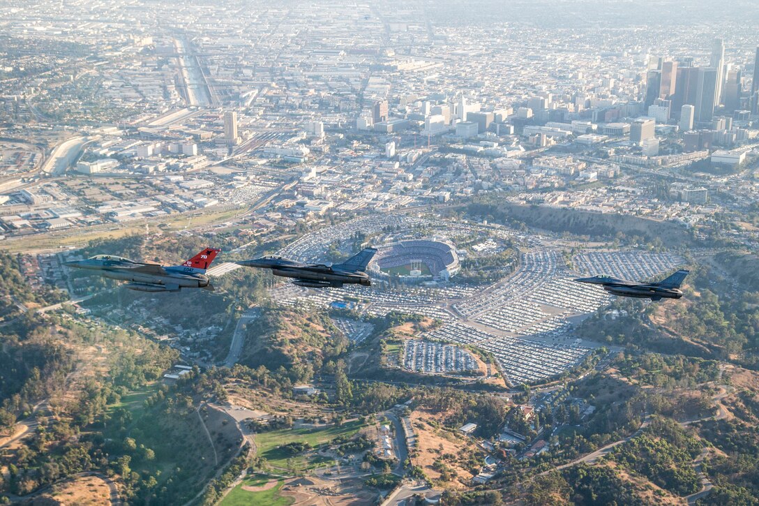 Three F-16 Fighting Falcons from Edwards AFB fly past Dodger Stadium after the ceremonial flyover at the beginning of game two of the 2017 World Series between the Los Angeles Dodgers and Houston Astros Oct. 25. (U.S. Air Force photo by Christopher Okula)