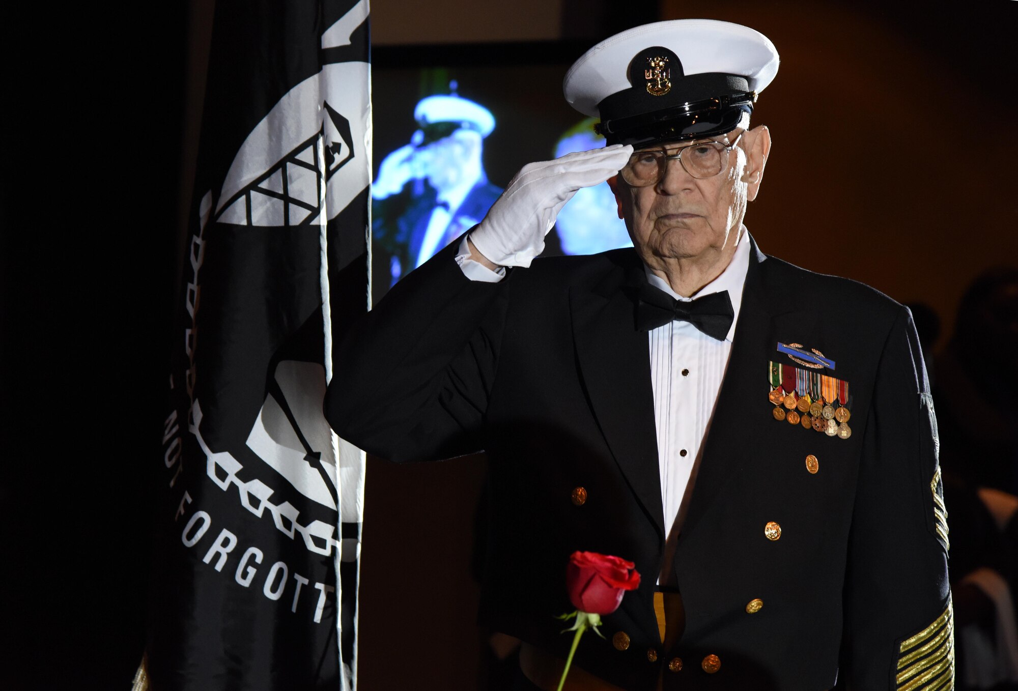 U.S. Navy retired Master Sgt. Chief Richard Wade, World War II, Korean War and Vietnam War veteran, renders a salute during a POW/MIA ceremony during the 39th Annual Salute to the Military at the Mississippi Coast Convention Center, Oct. 24, 2017, Biloxi, Mississippi. The Salute to the Military event recognized the men and women who serve in the military along the Gulf Coast. (U.S. Air Force photo by Kemberly Groue)