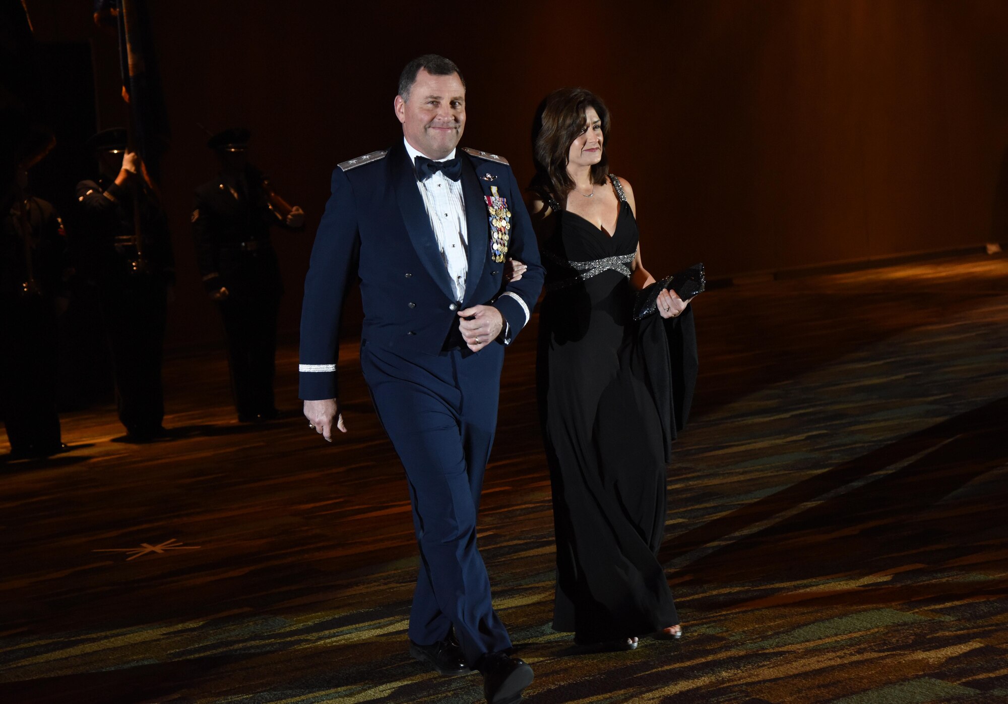 U.S. Air Force Maj. Gen. Timothy Leahy, 2nd Air Force commander, and his wife, Kathy,  make their way to the head table during the 39th Annual Salute to the Military at the Mississippi Coast Convention Center, Oct. 24, 2017, Biloxi, Mississippi. The Salute to the Military event recognized the men and women who serve in the military along the Gulf Coast. (U.S. Air Force photo by Kemberly Groue)