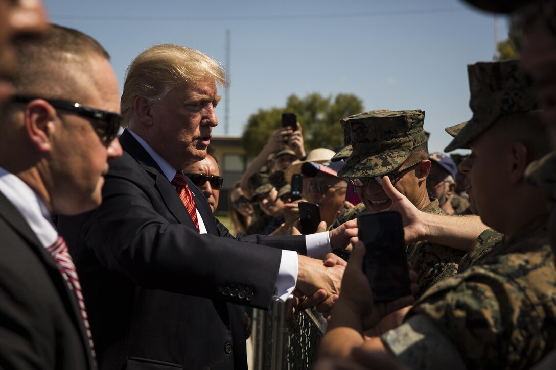 U.S. President Donald J. Trump shakes the hand of U.S. Marines during his visit to Marine Corps Air Station (MCAS) Yuma, Ariz., Aug. 22, 2017. President Trump visited MCAS Yuma to interact with Marines, Sailors and their families on station. (U.S. Marine Corps photo taken by Lance Cpl. Christian Cachola)