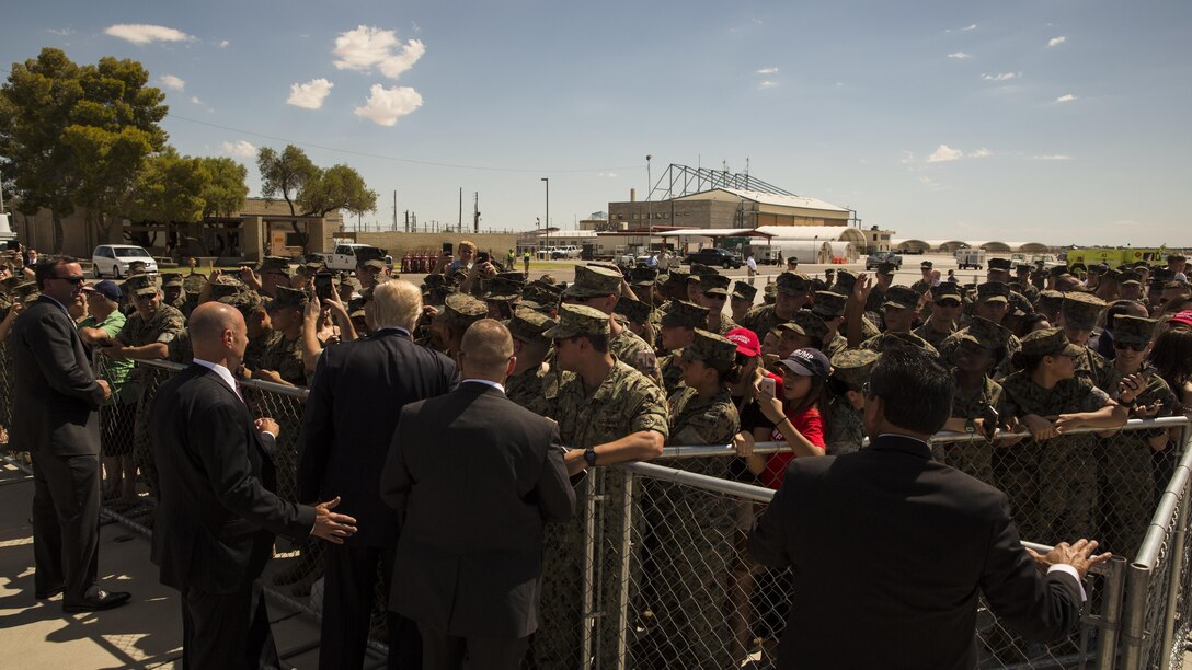 U.S. President Donald J. Trump shakes the hand of U.S. Marines during his visit to Marine Corps Air Station (MCAS) Yuma, Ariz., Aug. 22, 2017. President Trump visited MCAS Yuma to interact with Marines, Sailors and their families on station. (U.S. Marine Corps photo taken by Lance Cpl. Christian Cachola)