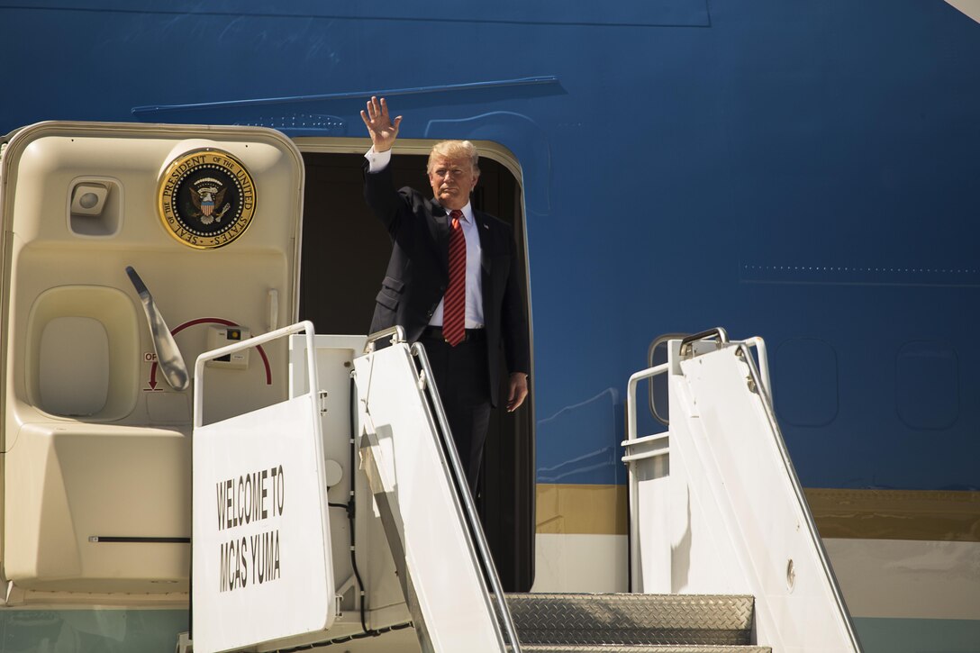 U.S. President Donald J. Trump waves farewell to Marines and their families during his visit to Marine Corps Air Station (MCAS) Yuma, Ariz., Aug. 22, 2017. President Trump visited MCAS Yuma to interact with Marines, Sailors and their families on station. (U.S. Marine Corps photo taken by Lance Cpl. Christian Cachola)