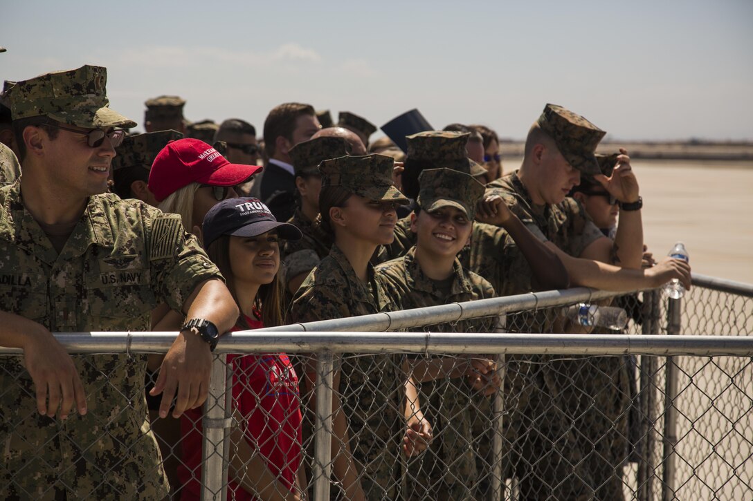U.S. Marines, Sailors, and family members stationed on Marine Corps Air Station (MCAS) Yuma, Ariz., wait to meet U.S. President Donald J. Trump Aug. 22, 2107. President Trump visited MCAS Yuma to interact with Marines, Sailors and their families on station. (U.S. Marine Corps photo taken by Lance Cpl. Isaac D. Martinez)