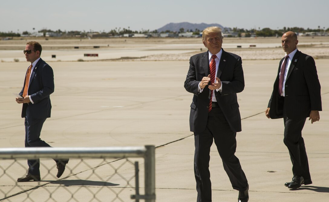 U.S. President Donald J. Trump claps with the crowd as they celebrate his safe arrival to Marine Corps Air Station (MCAS) Yuma, Ariz., Aug. 22, 2017. President Trump visited MCAS Yuma to interact with Marines, Sailors and their families on station. (U.S. Marine Corps photo taken by Lance Cpl. Isaac D. Martinez)