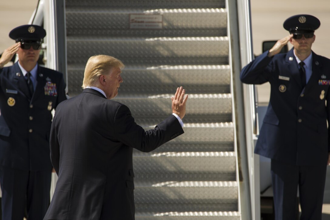 U.S. President Donald J. Trump boards Air Force One at the end of his visit to Marine Corps Air Station (MCAS) Yuma, Ariz., Aug. 22, 2017. President Trump visited MCAS Yuma to interact with Marines, Sailors and their families on station. (U.S. Marine Corps photo taken by Lance Cpl. Isaac D. Martinez)