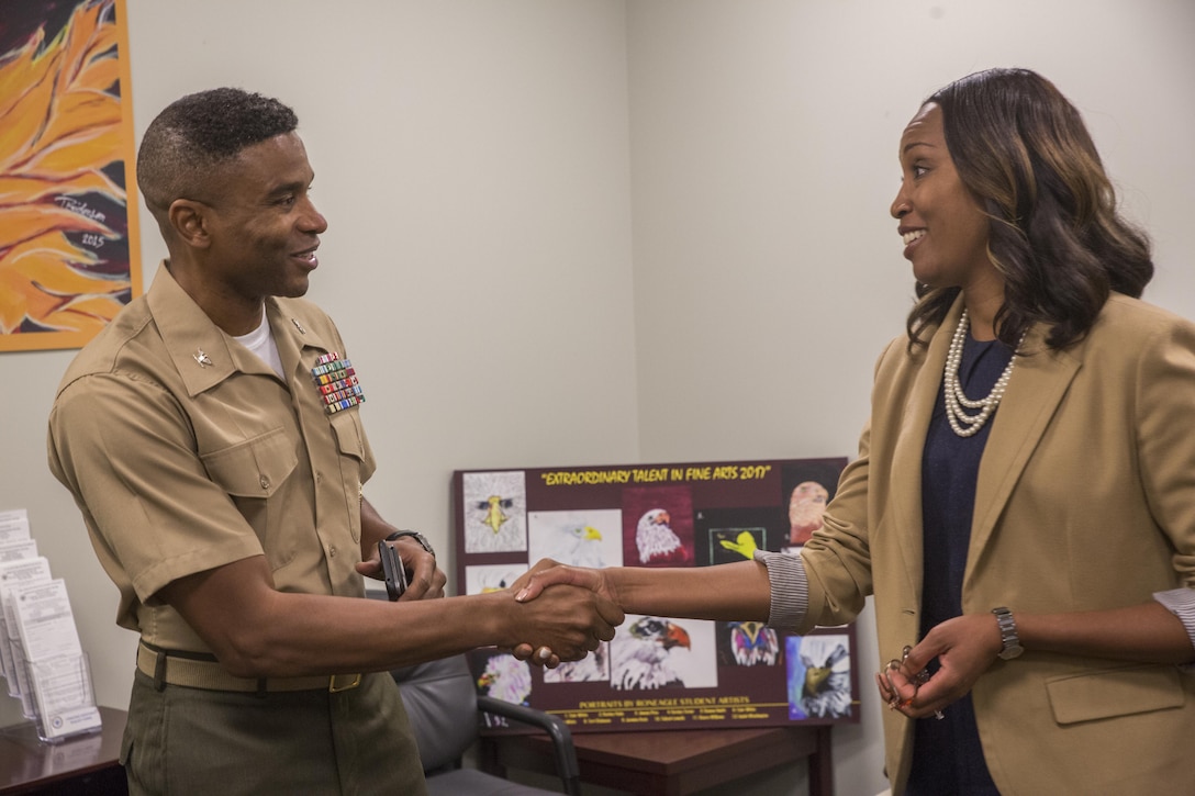 Col. Ricardo Player, the chief of staff of Force Headquarters Group, Marine Forces Reserve, introduces himself to Toni Pickett, the principle of McDonogh 35 High School in New Orleans, between lectures at McDonogh 35 High School, during Red Ribbon Week Oct. 23, 2017.