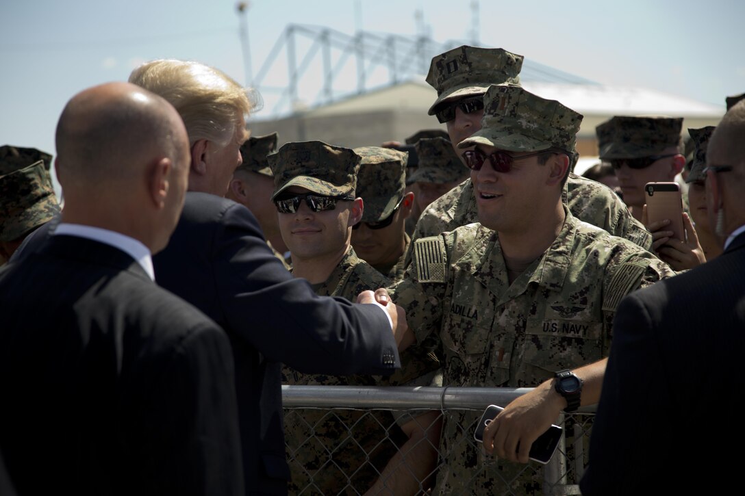 U.S. President Donald J. Trump shakes the hand of a U.S. Navy Sailor during his visit to Marine Corps Air Staton (MCAS) Yuma, Ariz., Aug. 22, 2017. President Trump visited MCAS Yuma to interact with Marines, Sailors and their families on station. (U.S. Marine Corps photo by Lance Cpl. Joel Soriano)