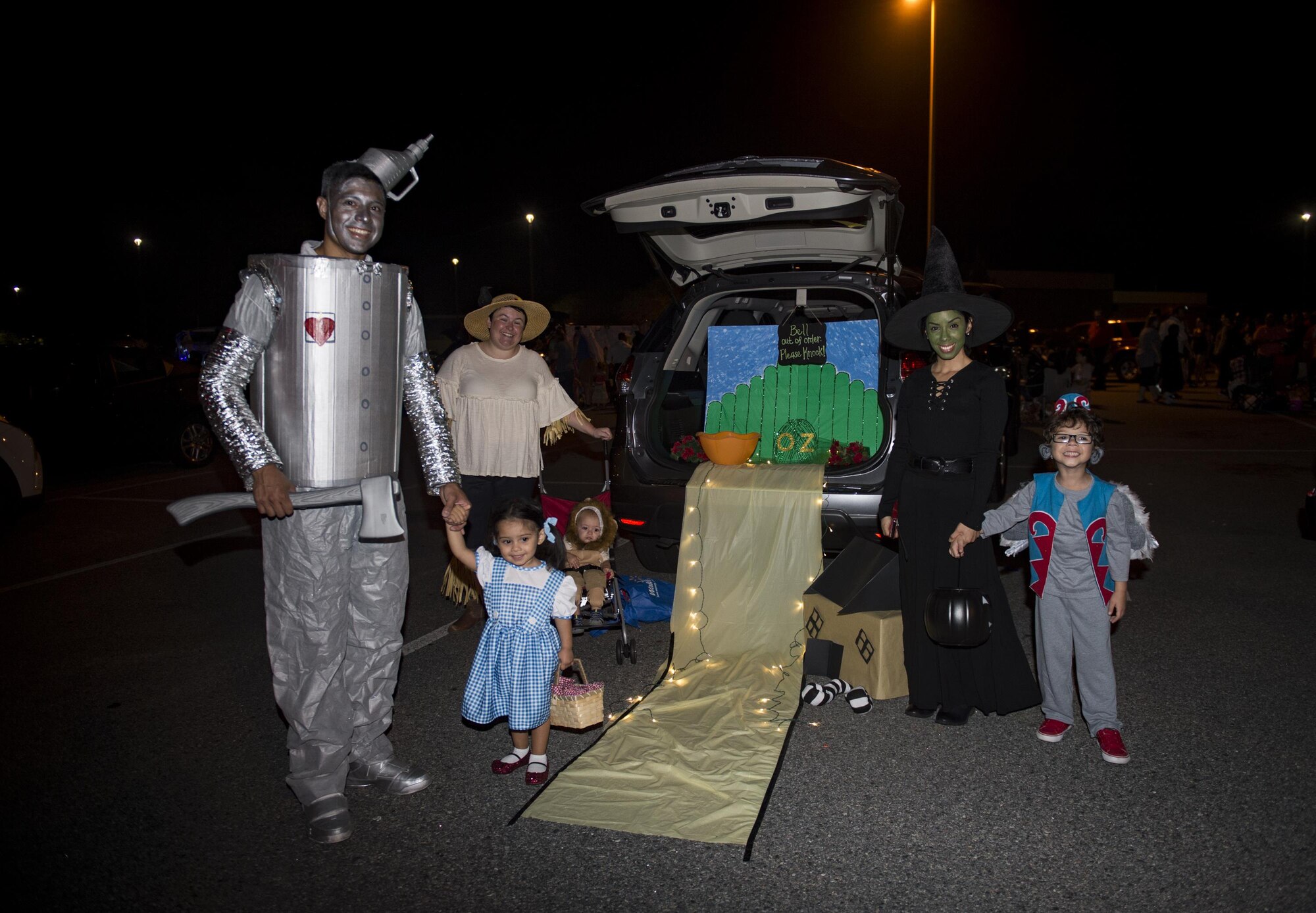 Trunk or Treaters dressed as characters of the Wizard of Oz pose for a photo at the Trunk or Treat event Oct. 20, 2017, at Moody Air Force Base, Ga. More than 3,500 Airmen and their families participated in the annual Trunk or Treat event hosted by the 23d Force Support Squadron Youth Programs. (U.S. Air Force photo by Andrea Jenkins)