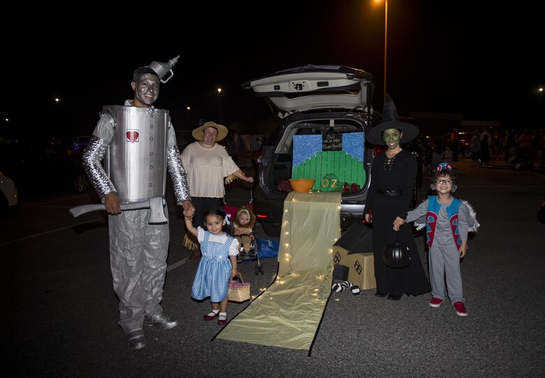 Trunk or Treaters dressed as characters of the Wizard of Oz pose for a photo at the Trunk or Treat event Oct. 20, 2017, at Moody Air Force Base, Ga. More than 3,500 Airmen and their families participated in the annual Trunk or Treat event hosted by the 23d Force Support Squadron Youth Programs. (U.S. Air Force photo by Andrea Jenkins)