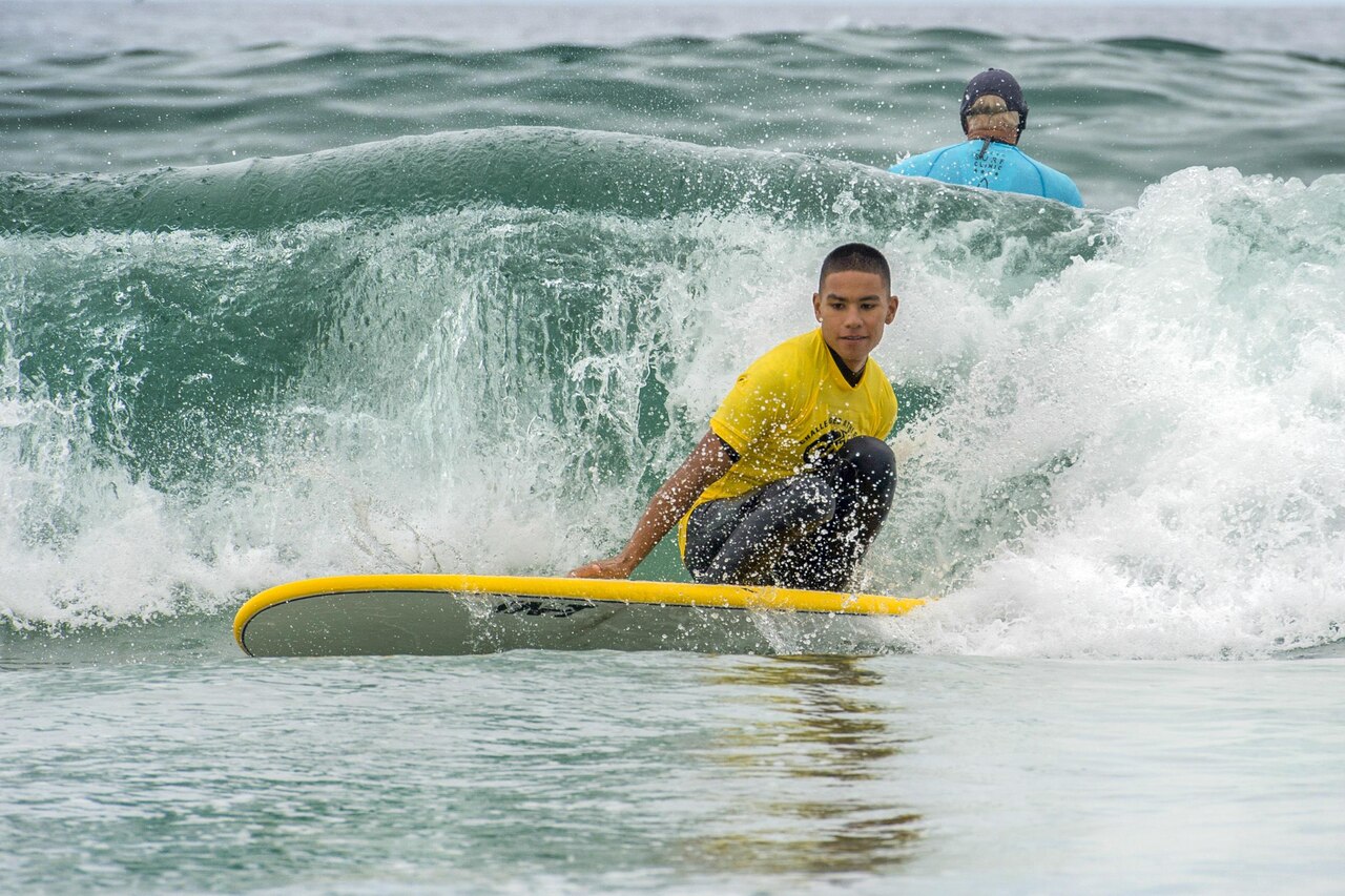 Marine surfs a closed out wave.