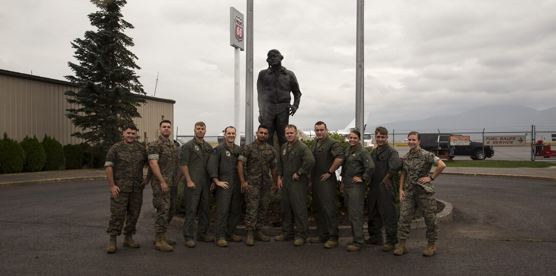 U.S. Marines assigned to Marine Attack Squadron (VMA) 214 pose in front of the Pappy Boyington Statue in Coeur d'Alene, Idaho, Aug. 13, 2017. VMA-214 flew to Coeur d’Alene to celebrate the 10th anniversary of renaming the airport to “Coeur d’Alene Airport – Pappy Boyington Field.” (U.S. Marine Corps photo taken by Lance Cpl. Christian Cachola)