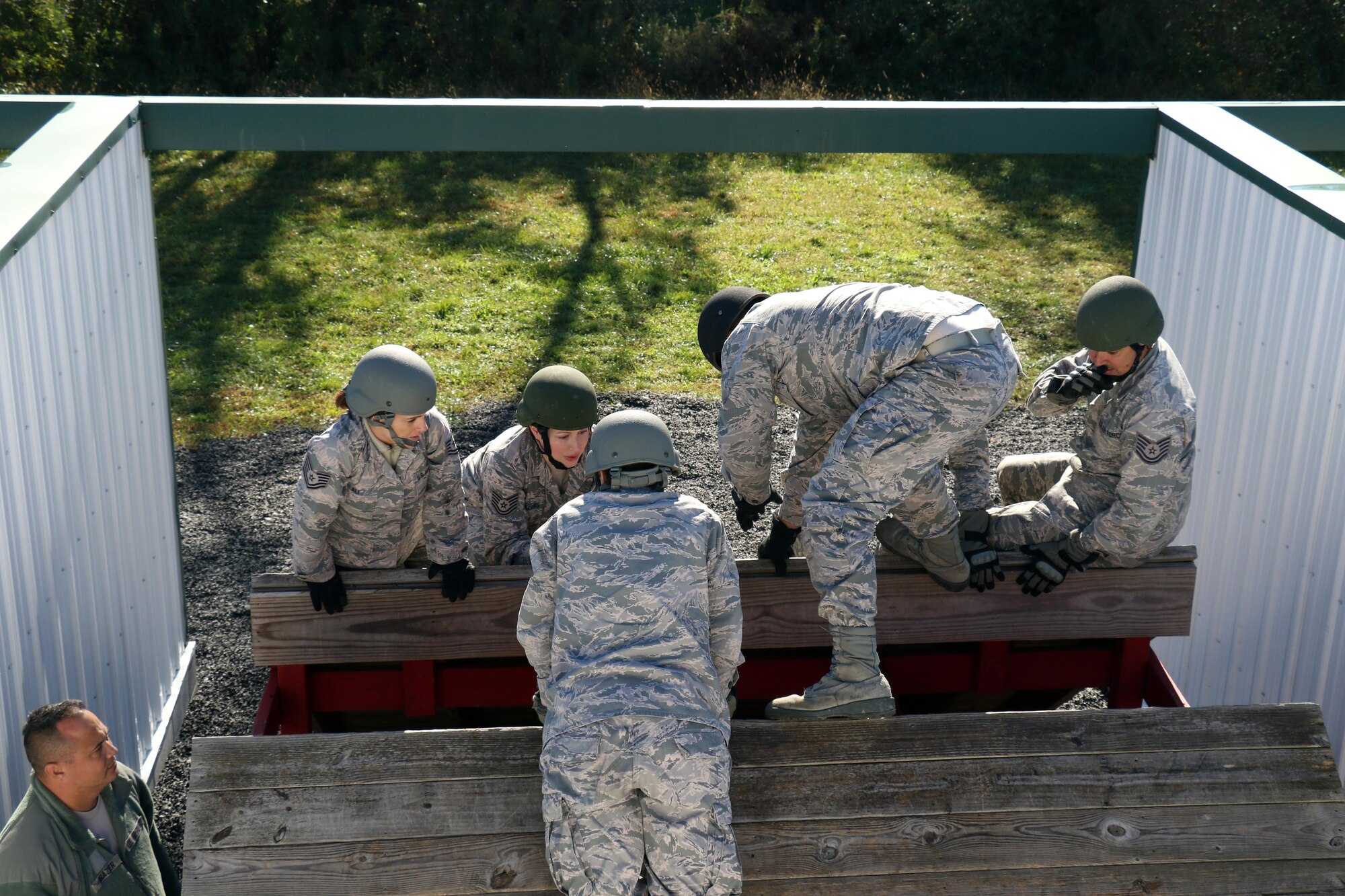 Production Recruiter and Retention Airmen navigate obstacles on a Leadership Reaction Course at Fort Indiantown Gap, Pennsylvania, Oct. 17, 2017. The PRR Airmen are part of Strength Management Teams from the three Air National Guard Wings in the Commonwealth; whom came together during a week-long Pennsylvania Air National Guard Fall Leadership Forum.  (U.S. Air National Guard photo by Master Sgt. Culeen Shaffer/Released)