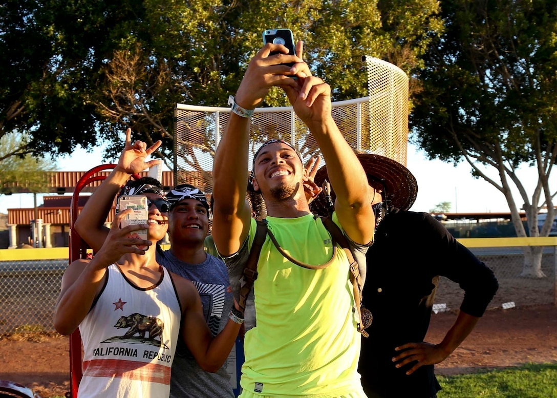 U.S. Marines with Marine Aviation Logistics Squadron (MALS) 13 take a selfie between events of the Scavenger Challenge at Marine Corps Air Station Yuma, Ariz., Aug. 12, 2017. The Scavenger Challenge was hosted by Marine Corps Community Services (MCCS) and featured 10 events, where Marines, Sailors, and civilians competed for the chance to take home first place.