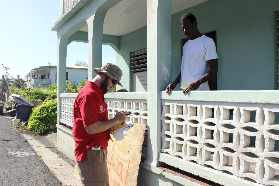 Pasadena, Md., resident Matt Breitenother, of the U.S. Army Corps of Engineers, Baltimore District, assists a homeowner in Frederiksted with assessing his eligibility for the U.S. Army Corps of Engineers Operation Blue Roof Program, Oct. 22, 2017 in St. Croix, U.S. Virgin Islands. Breitenother is one of dozens of Baltimore District employees deploying to assist with hurricane recovery efforts primarily in the U.S. Virgin Islands and Puerto Rico.