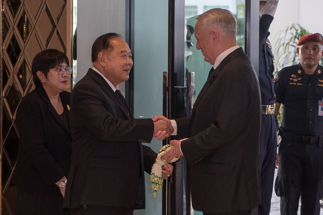 Defense Secretary Jim Mattis shakes hands with Thailand's defense minister.