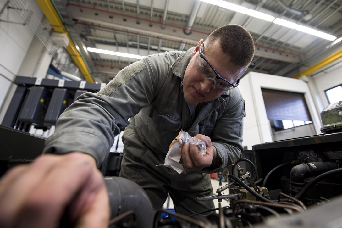 U.S. Air Force Senior Airman Nicholas Okpysh, 86th Maintenance Squadron Aerospace Ground Equipment journeyman, services an A\M32A-86 generator set at the AGE facility on Ramstein Air Base, Germany, Oct. 25, 2017. The generators supply aircraft with power so maintainers and crew chiefs can work on them, allowing the mission to continue. (U.S. Air Force photo by Senior Airman Devin Boyer)