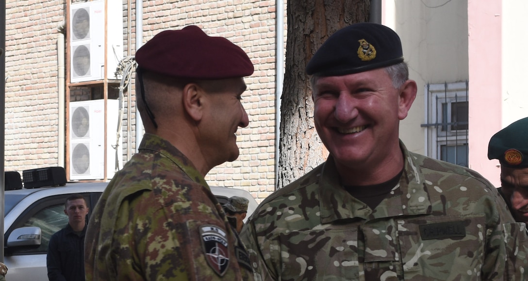 Lieutenant General Richard Cripwell, the new deputy commander of Resolute Support, shakes hands with Lieutenant General Rosario Castellano, the outgoing deputy, during a change of responsibility ceremony at Resolute Support headquarters in Kabul, Afghanistan Oct. 24, 2017. (Photo by Air Force Staff Sergeant Regina Edwards)