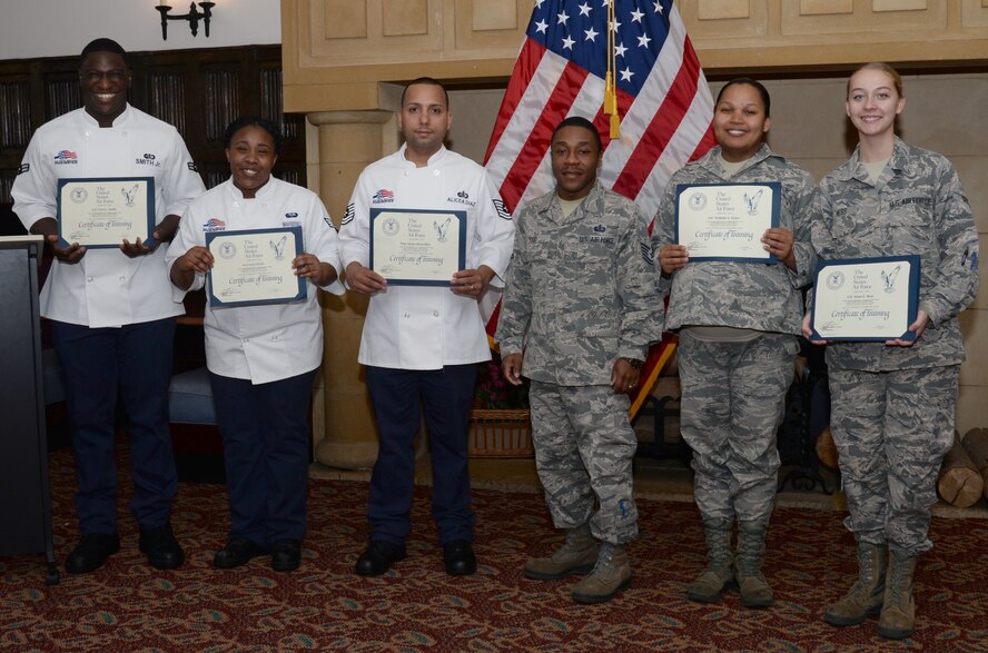 U.S. Air Force Tech. Sgt Charles Todd, 345th Training Squadron services shift-lead instructor, center, stands with the graduating students of the dining facility shift-lead course, at RAF Mildenhall, England Oct. 27, 2017. The five Airmen completed a two-part course, consisting of a classroom and hands-on portion, designed to provide supervisorial skills. (U.S. Air Force photo by Senior Airman Justine Rho)