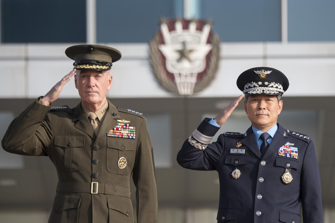 Gen. Joe Dunford and his South Korean counterpart salute during a welcoming ceremony.