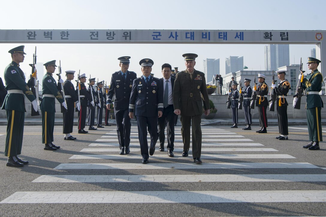 Gen. Joe Dunford walks alongside his South Korean counterpart during a welcoming ceremony in Seoul.