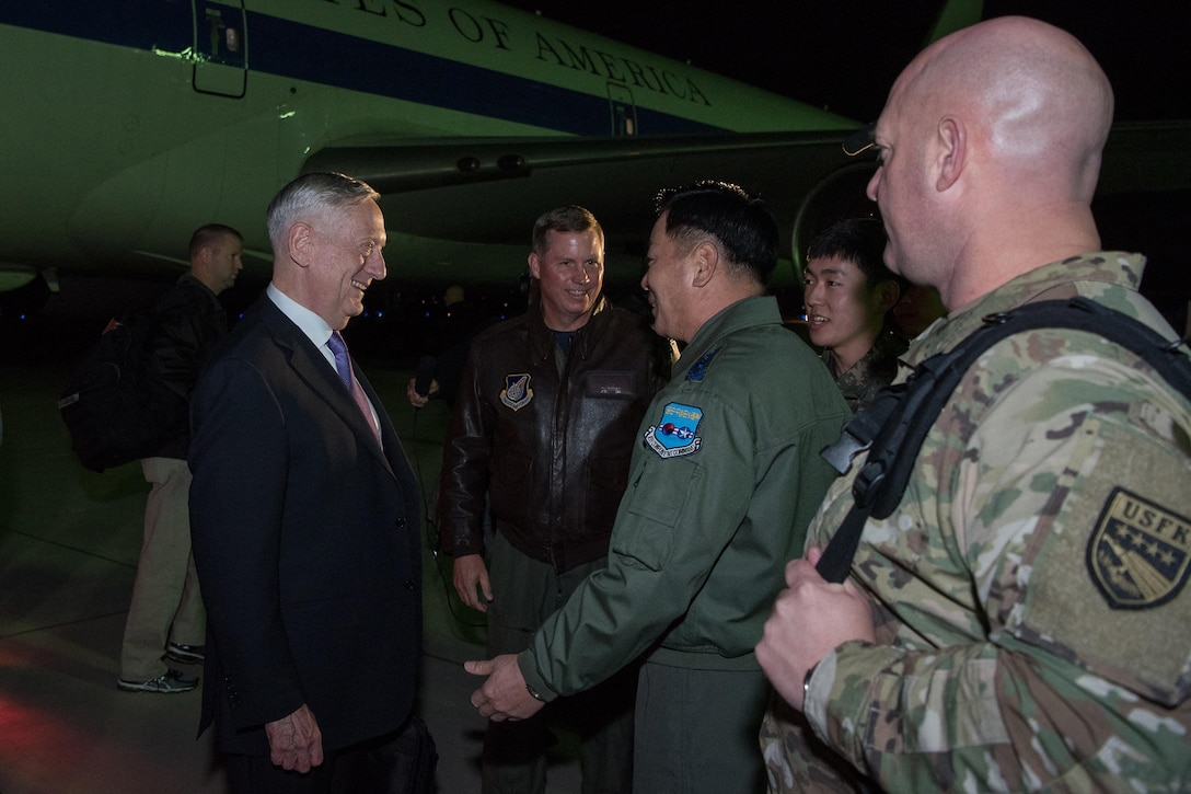 Defense Secretary Jim Mattis is greeted at Osan Air Base, South Korea.