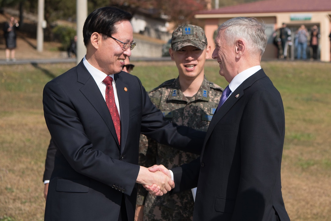 Defense Secretary Jim Mattis shakes hands with the South Korean defense minister.