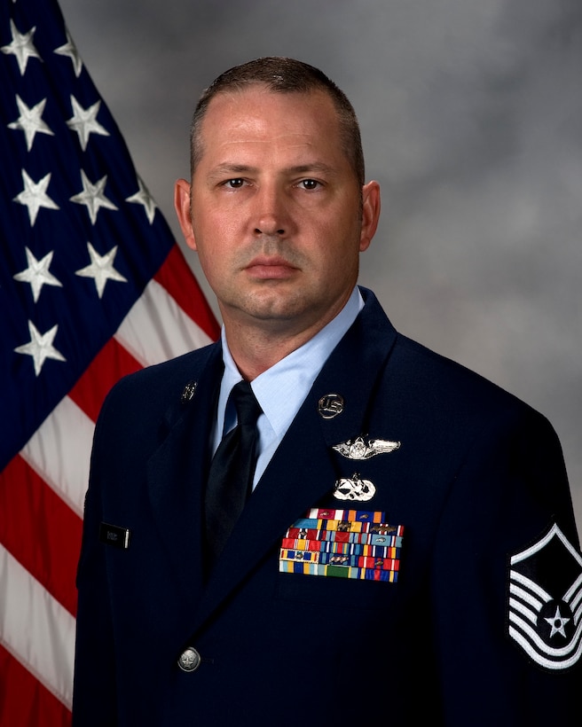 Master Sgt. Louis Davis, 9th Airlift Squadron flight engineer, poses for an official photo April 27, 2017, at Dover Air Force Base, Del. Davis won the 2016 General Robert “Dutch” Huyser Outstanding Aircrew Member Award, Flight Engineer category. (U.S. Air Force photo by Mauricio Campino)