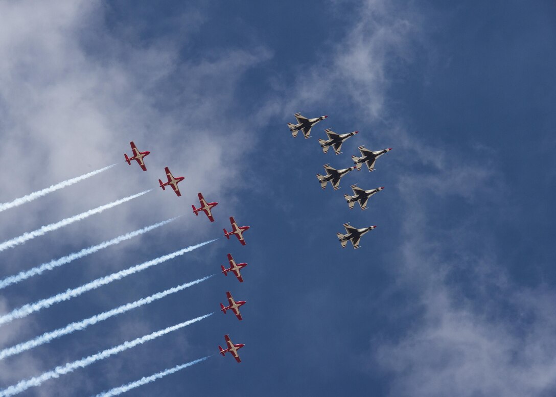 The U.S. Air Force Thunderbirds and the Royal Canadian Snowbirds fly in formation during their arrival to Boise, Idaho Oct. 12, 2017. The Thunderbirds and Snowbirds were both headline acts for the Gowen Thunder Open House and Airshow, the first airshow hosted by the Idaho National Guard in more than 20 years. (U.S. Air National Guard photo by Master Sgt. Joshua C. Allmaras)