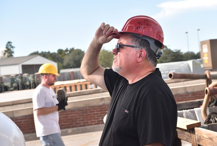 Tom Dybowski, 437th Aerial Port Squadron airfreight operations manager, looks on as a helicopter training device is being weighed at Joint Base Charleston, S.C., Oct. 19, 2017.