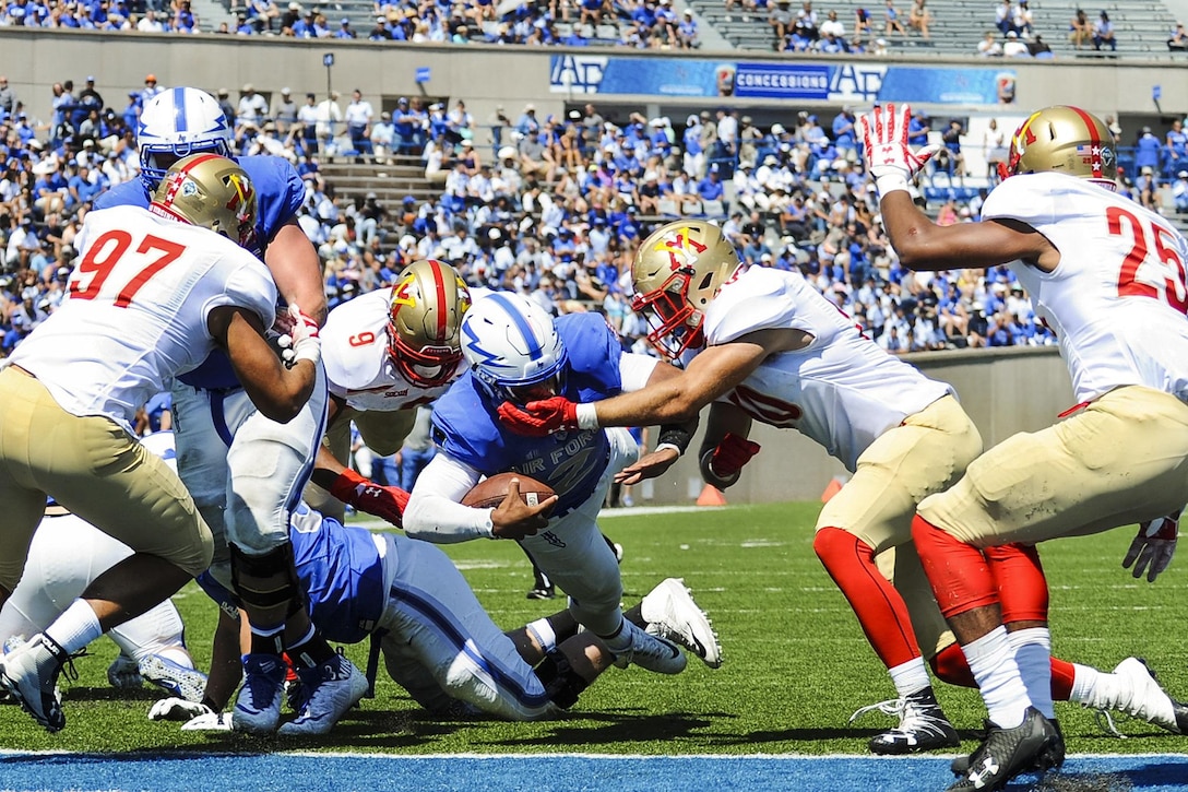 An Air Force quarterback dives for a touchdown.