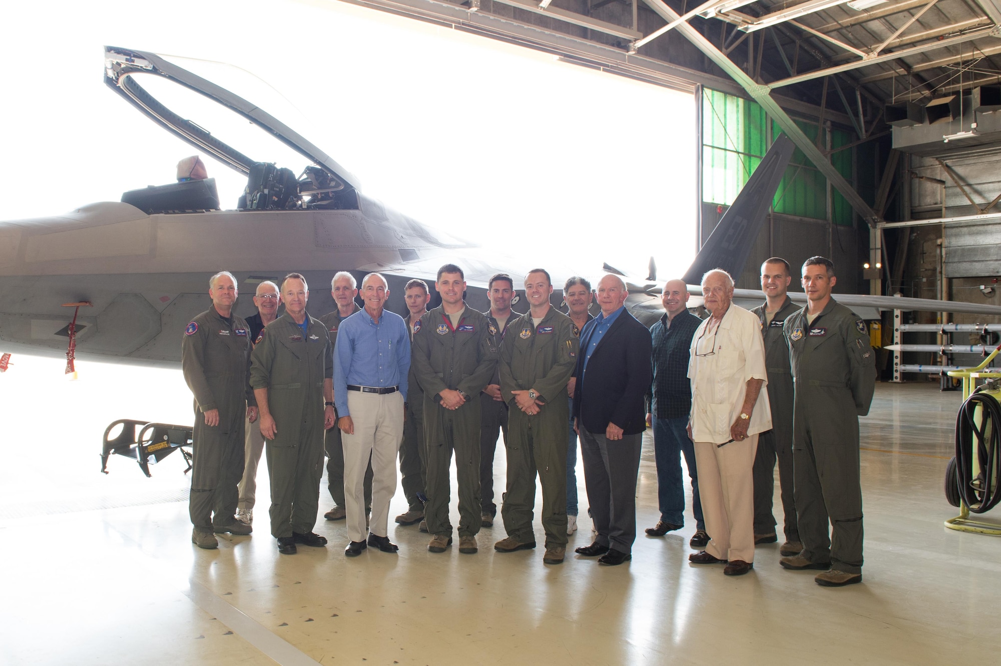 Members of the F-22 Combined Test Force and special guests pose for a photo in front of one the CTF’s F-22 Raptors. The CTF held a ceremony Oct. 19 to commemorate the first flight of the F-22. (U.S. Air Force photo by Jennifer Correa)